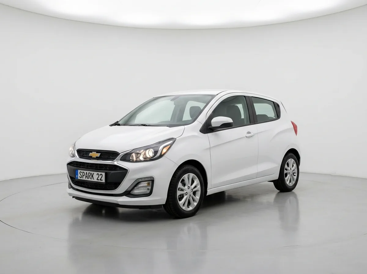 Chevrolet Spark economy hatchback, white car on clean studio background, front 3/4 angle, rental car photography style